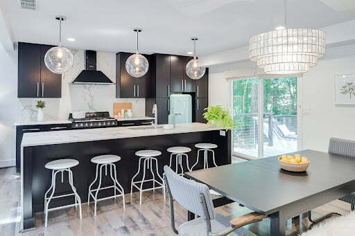 a kitchen with a table and chairs