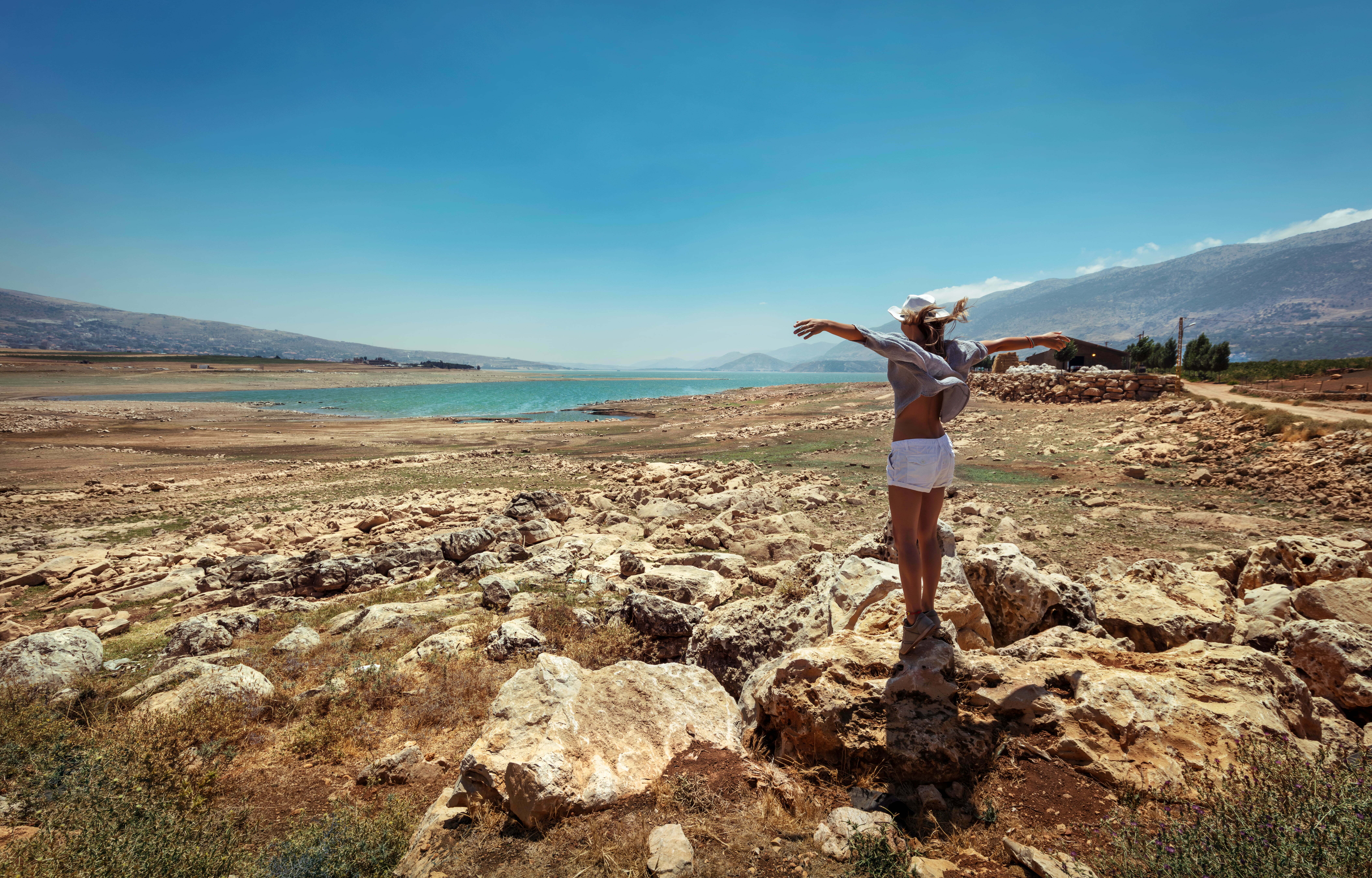 a man standing on a rocky hill